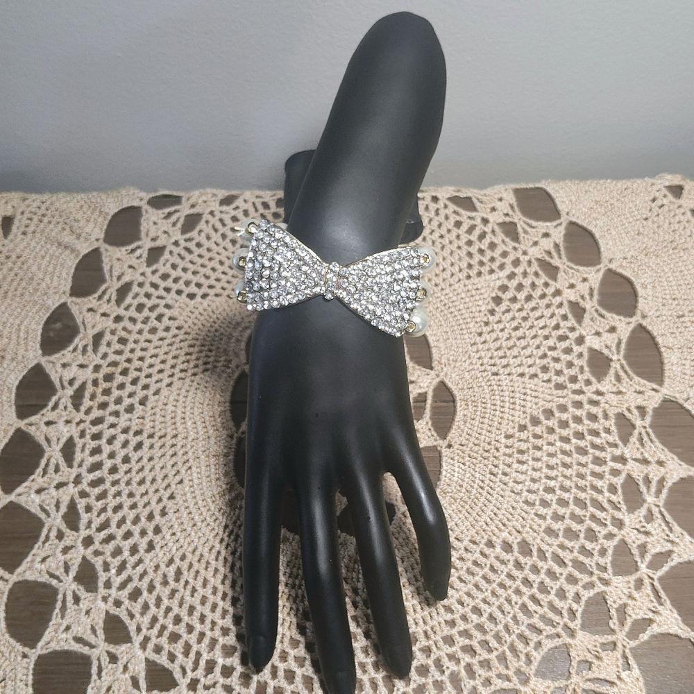 Elegant Bowtie And Multi Strand Pearl Bracelet